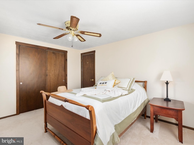 bedroom with light carpet and ceiling fan