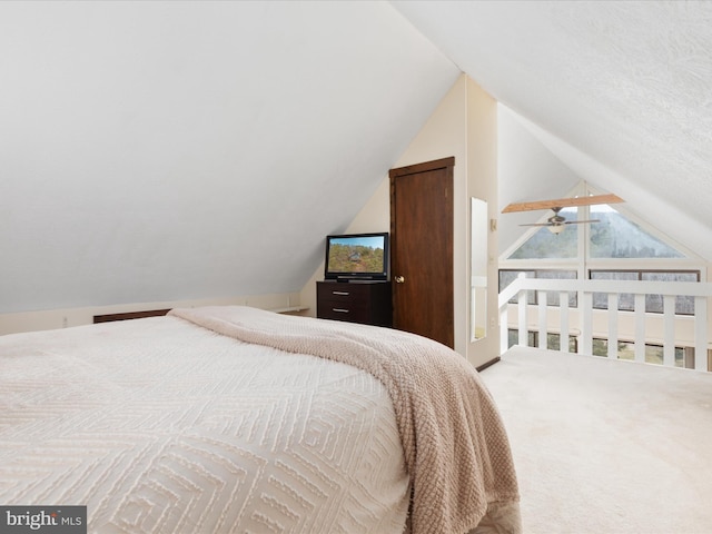 bedroom with lofted ceiling and carpet flooring