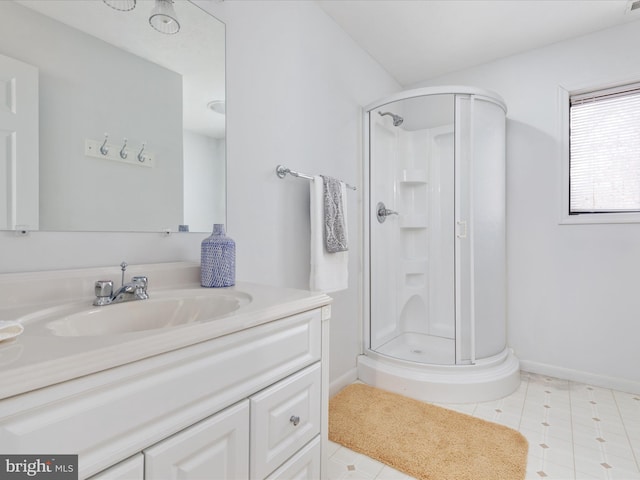 bathroom with vanity and a shower with door