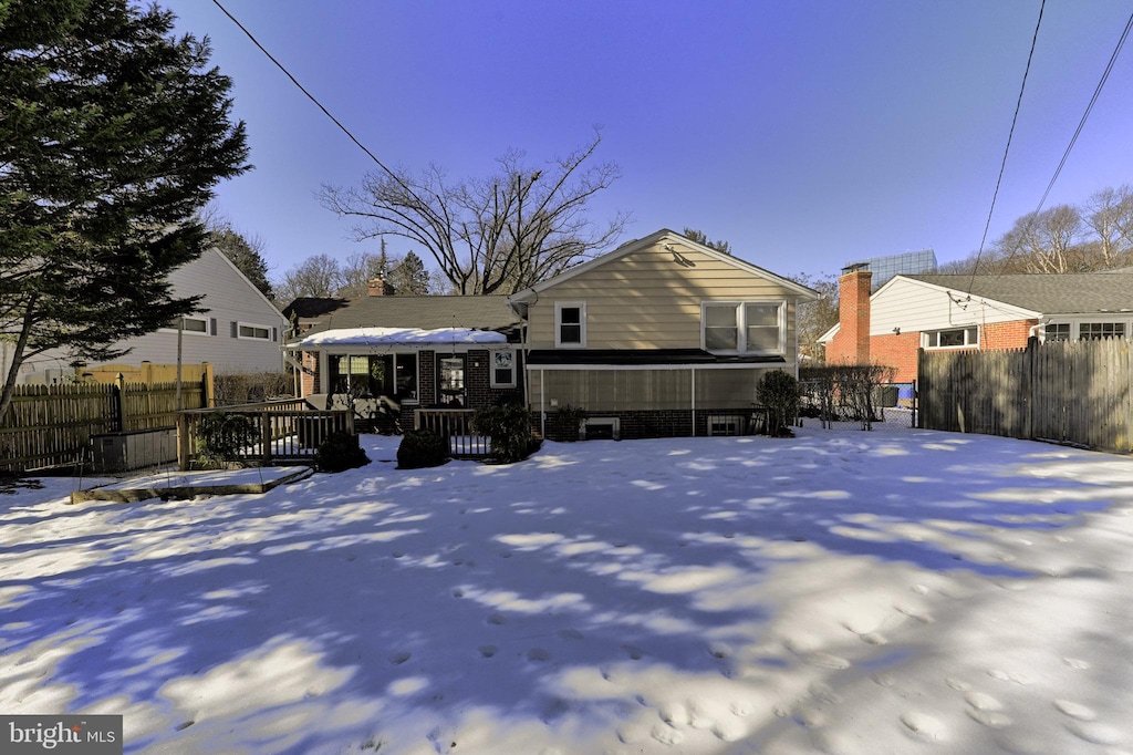 view of snow covered house