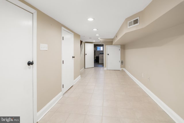 hallway with light tile patterned flooring