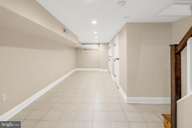 hallway featuring light tile patterned floors