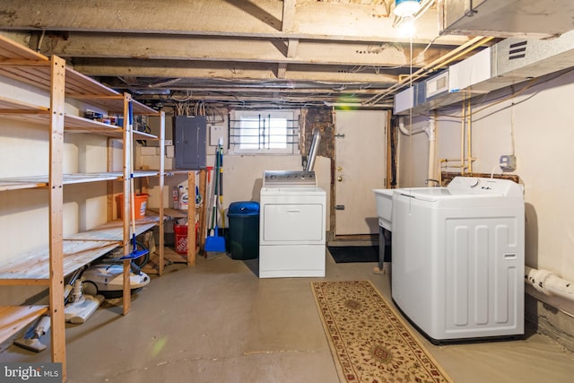 basement featuring independent washer and dryer and electric panel