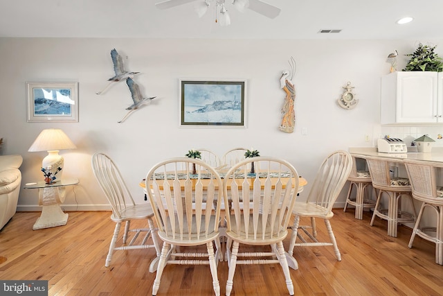 dining room featuring ceiling fan and light hardwood / wood-style floors