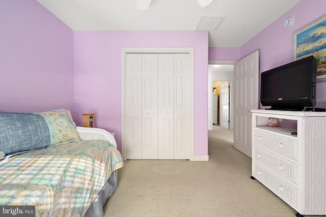 carpeted bedroom with a closet