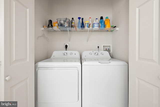 washroom featuring independent washer and dryer