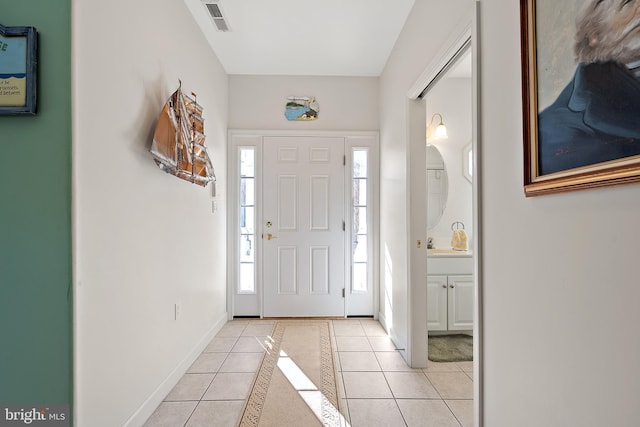 entrance foyer featuring light tile patterned floors