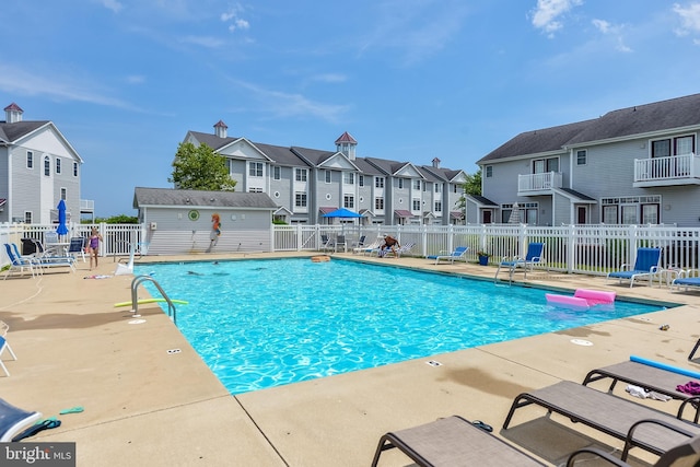 view of swimming pool featuring a patio area