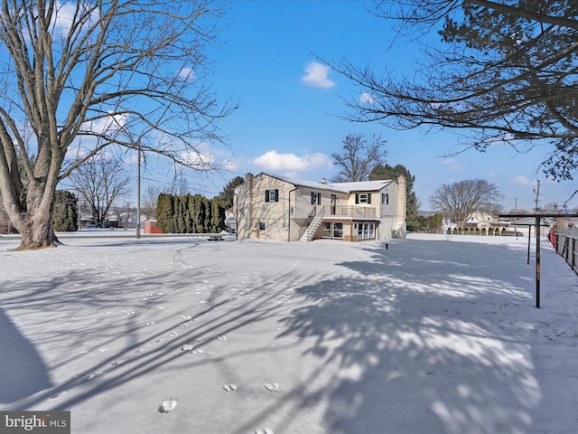 view of front of home featuring a wooden deck