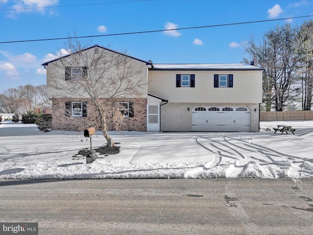 view of front of property with a garage