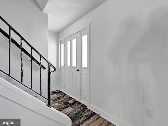 entrance foyer with dark hardwood / wood-style flooring