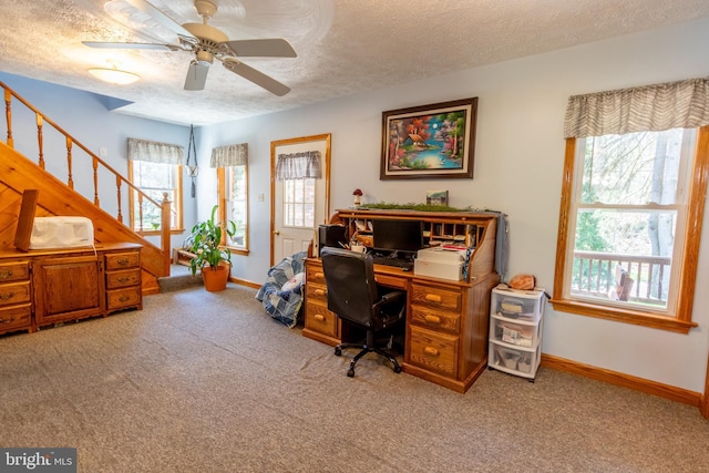 office with ceiling fan, light colored carpet, and a textured ceiling