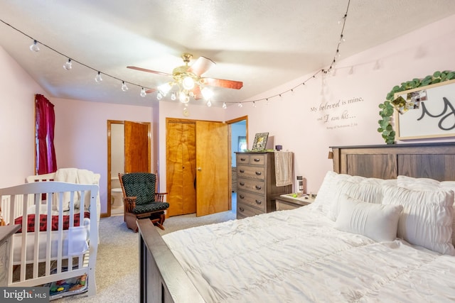 carpeted bedroom featuring ceiling fan