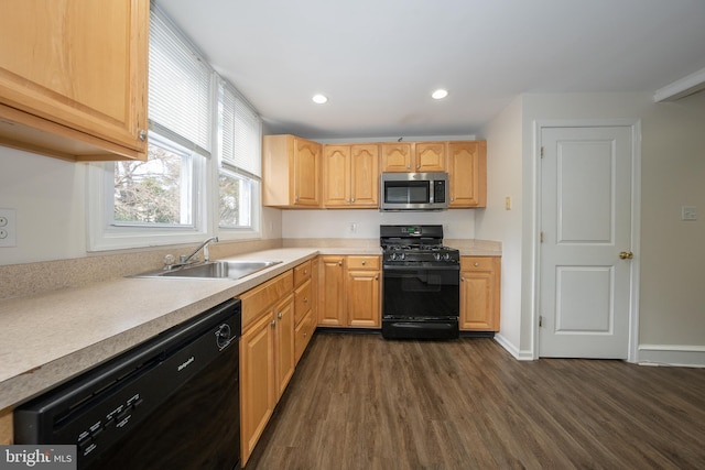 kitchen with sink, black appliances, dark hardwood / wood-style floors, and light brown cabinets