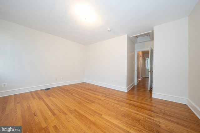 spare room featuring light hardwood / wood-style flooring