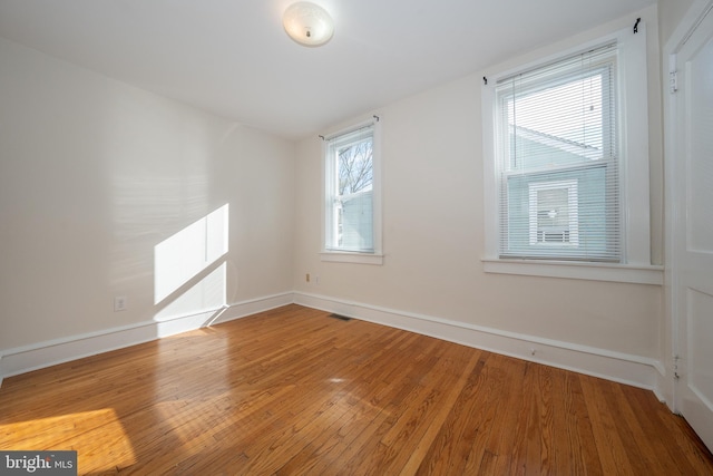 empty room featuring wood-type flooring