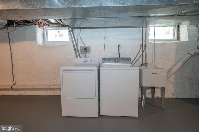 laundry room featuring sink and washer and clothes dryer