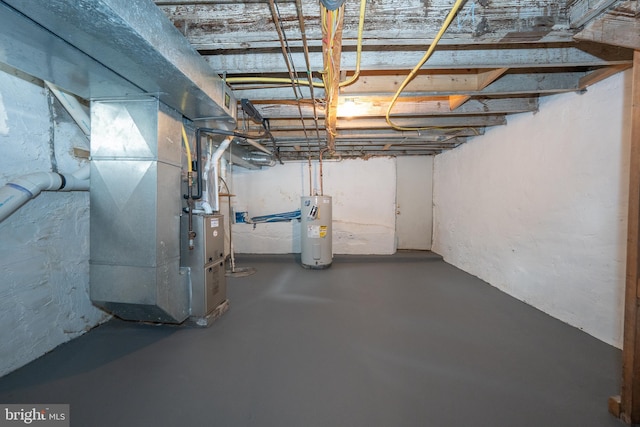 basement featuring heating unit and water heater