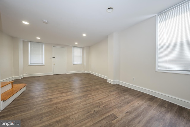 spare room featuring dark hardwood / wood-style flooring