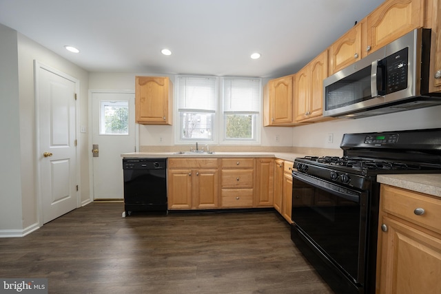 kitchen with dark wood-type flooring, sink, light brown cabinetry, and black appliances