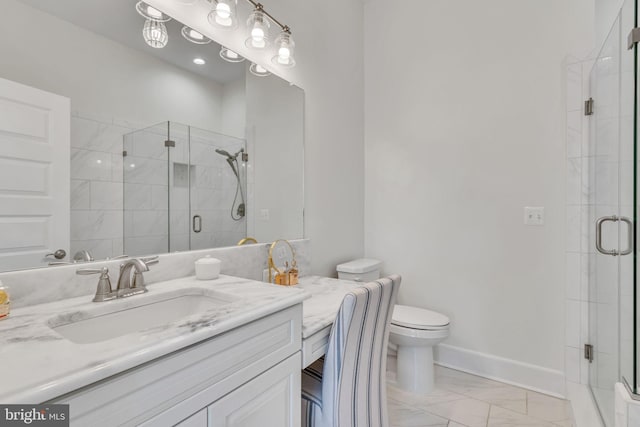 bathroom featuring vanity, a shower with shower door, and toilet