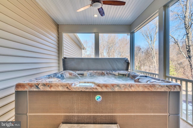 unfurnished sunroom with a jacuzzi