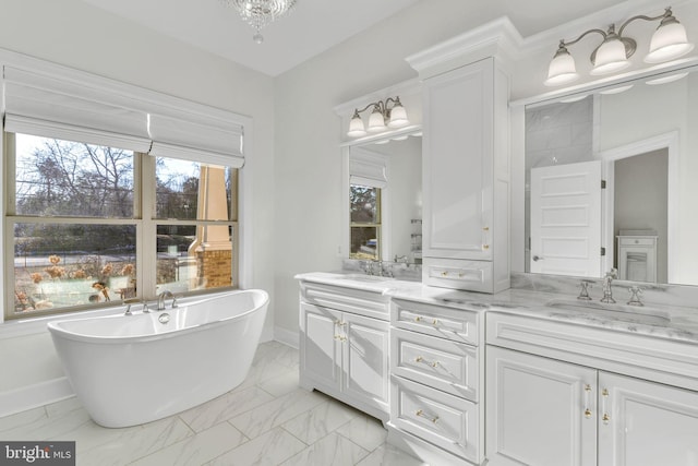 bathroom with a tub to relax in and vanity