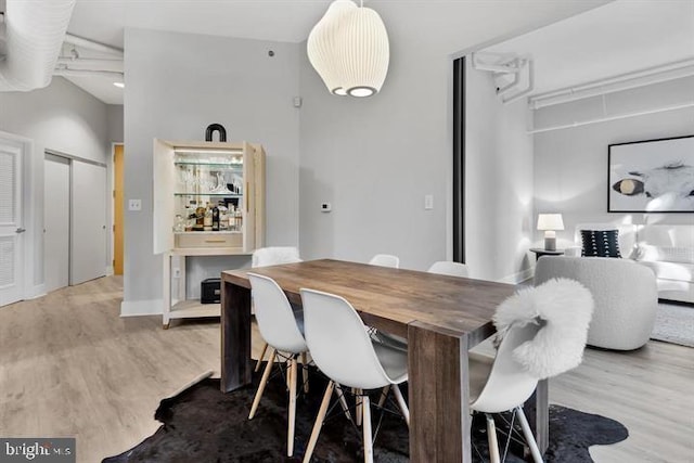 dining space with light wood-type flooring