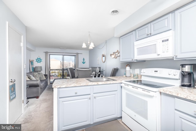 kitchen featuring sink, white cabinetry, kitchen peninsula, pendant lighting, and white appliances