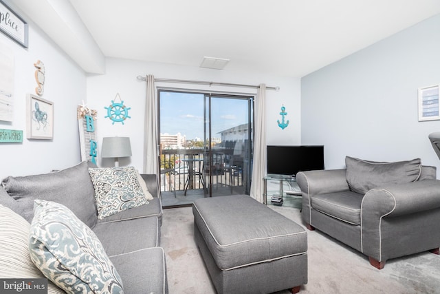 living room featuring light colored carpet