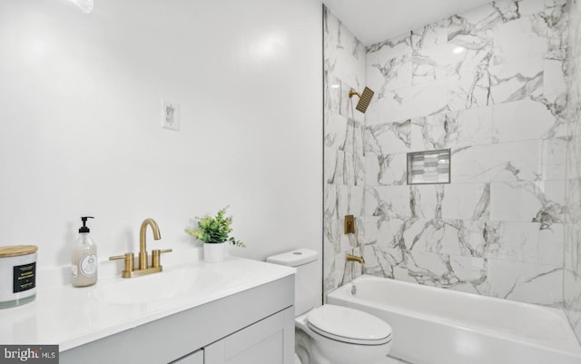 full bathroom with vanity, toilet, and tiled shower / bath combo