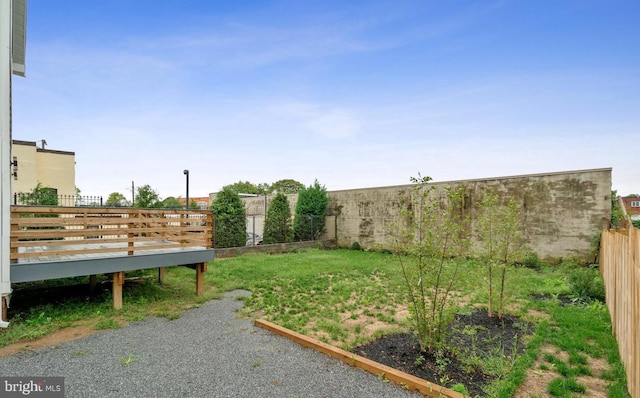 view of yard featuring a wooden deck