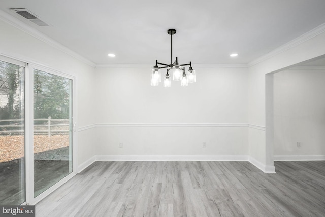 unfurnished dining area with ornamental molding, light hardwood / wood-style flooring, and a notable chandelier