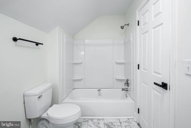 bathroom featuring bathtub / shower combination, toilet, and vaulted ceiling