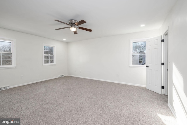 carpeted empty room with ceiling fan