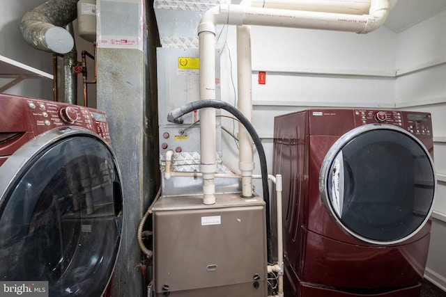 laundry room with separate washer and dryer