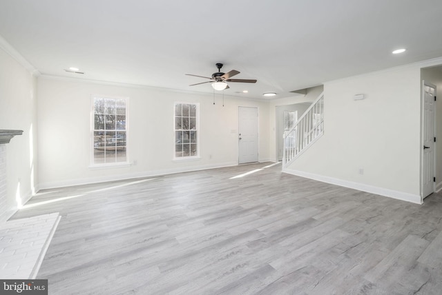 unfurnished living room with ornamental molding, ceiling fan, and light hardwood / wood-style flooring