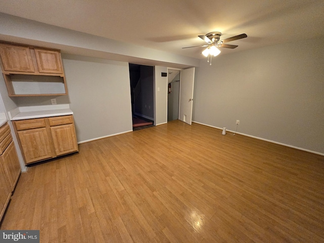 interior space with ceiling fan and light hardwood / wood-style floors