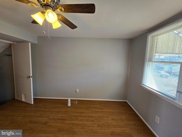 unfurnished bedroom with ceiling fan, hardwood / wood-style floors, and a closet