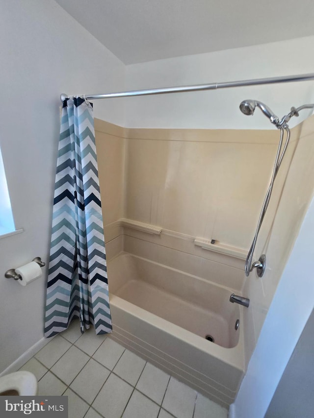 bathroom featuring shower / bathtub combination with curtain and tile patterned floors