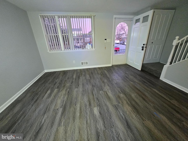 entrance foyer with dark hardwood / wood-style floors