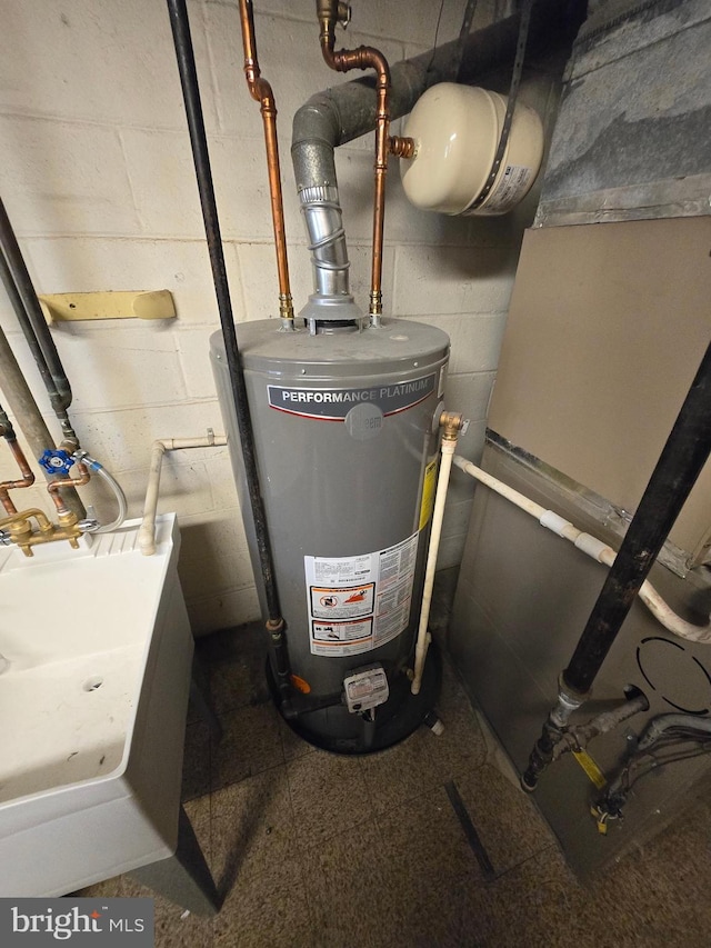 utility room featuring gas water heater