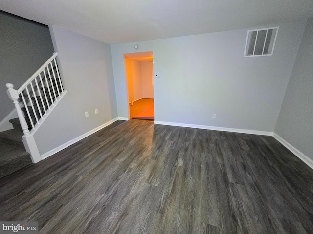 empty room featuring dark hardwood / wood-style floors