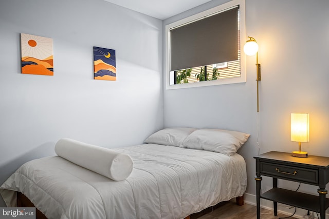 bedroom featuring dark wood-type flooring