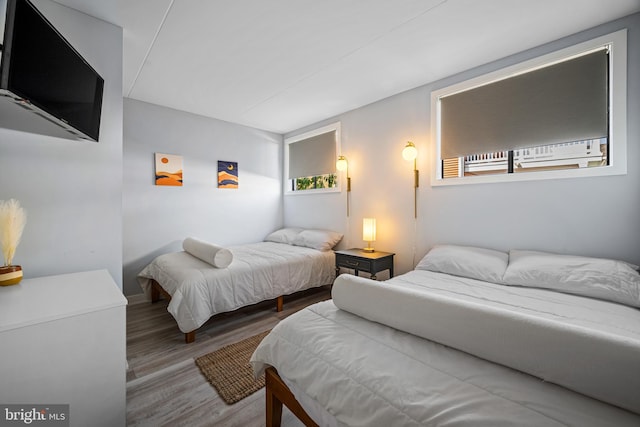 bedroom with wood-type flooring