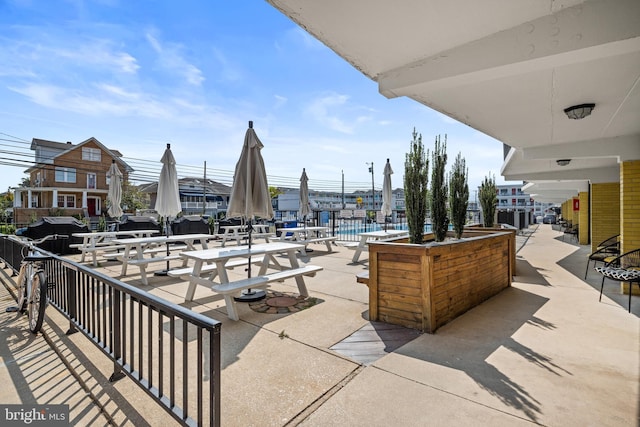 view of patio with a community pool