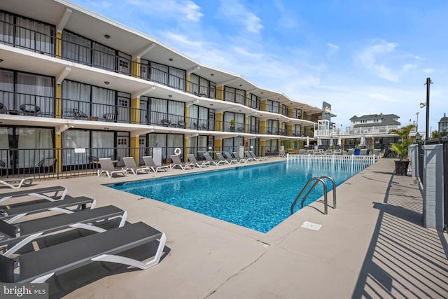 view of swimming pool featuring a patio area