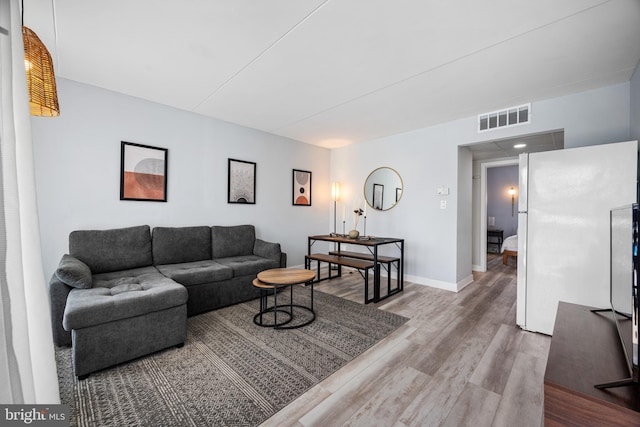 living room with hardwood / wood-style flooring