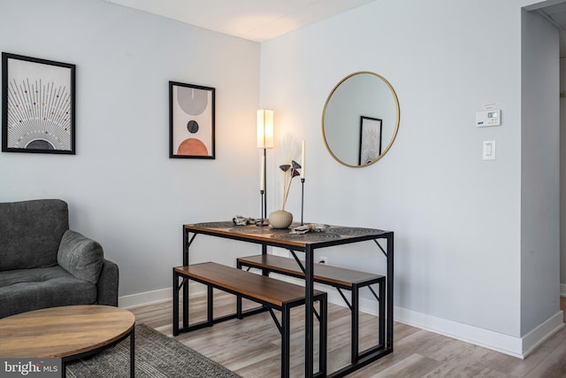 dining space with light hardwood / wood-style floors