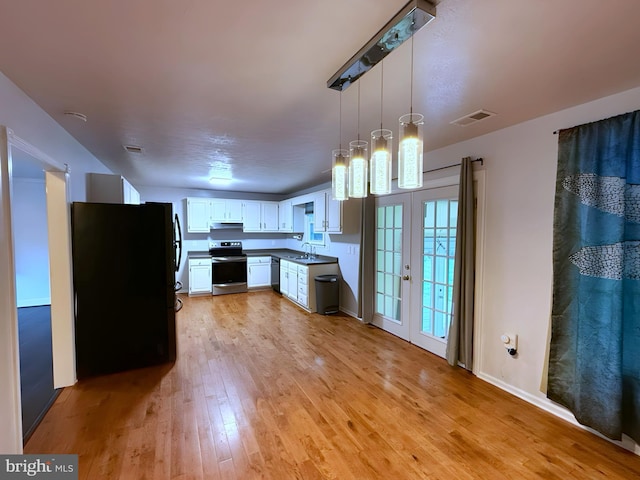 kitchen featuring sink, white cabinetry, light hardwood / wood-style flooring, hanging light fixtures, and black appliances